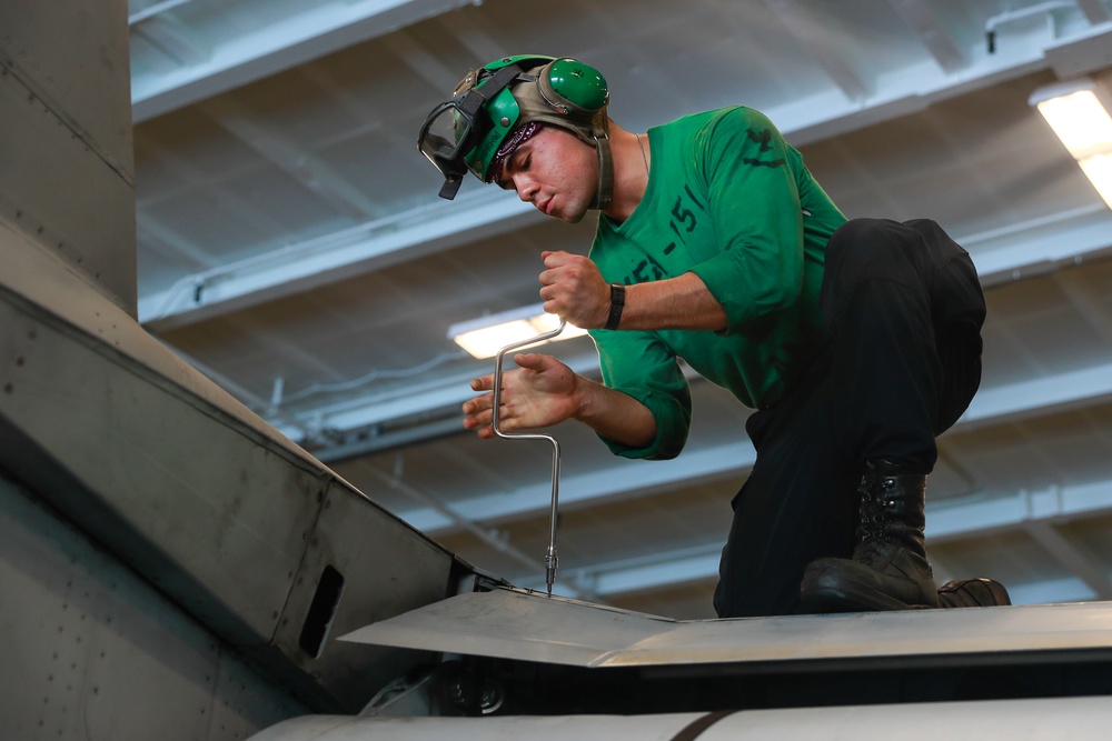 Abraham Lincoln Sailors conduct aircraft maintenance