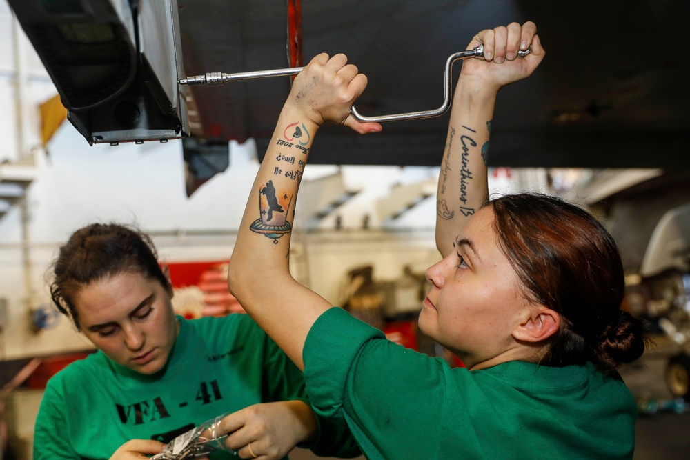 Abraham Lincoln Sailors conduct aircraft maintenance