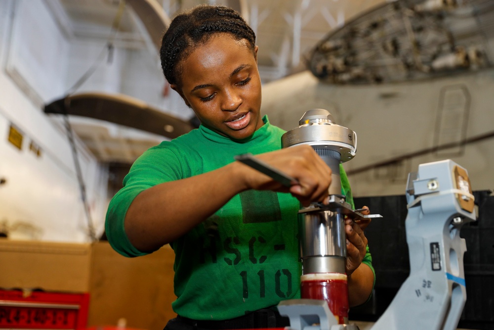 Abraham Lincoln Sailors conduct aircraft maintenance