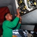 Abraham Lincoln Sailor conducts aircraft maintenance
