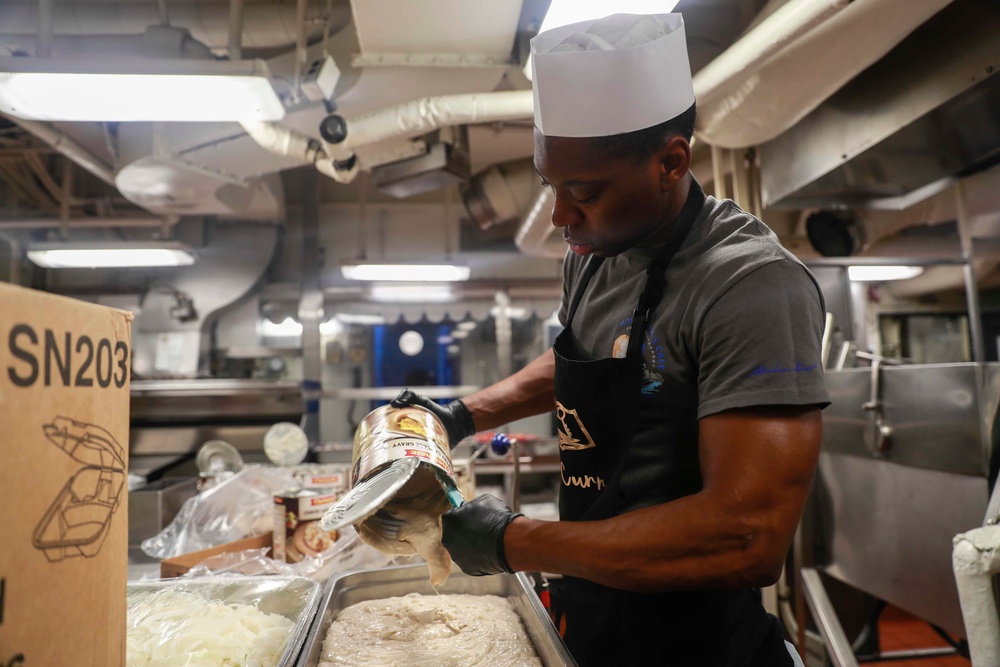 Abraham Lincoln Sailors prepares food