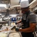 Abraham Lincoln Sailors prepares food