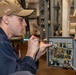 Gas Turbine Systems Technician (Electrical) 3rd Class Trevor Humphries, from Charlotte, N.C., solders a replacement switch in an engineering space