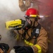 Information System Technician 3rd Class Conor Nichols, from Texarkana, Texas uses a Naval Firefighter Thermal Imager during a firefighting drill