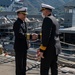 Cmdr. Thomas McCandless, commanding officer, Arleigh Burke-class guided-missile destroyer USS Mitscher (DDG 57) greets Rear Adm. Mehmet Emre Sezenler, Turkish Navy, commander, South Task Group Command, during a ship tour