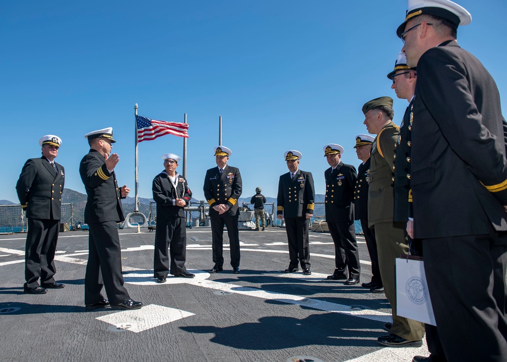 Cmdr. Thomas McCandless, commanding officer, Arleigh Burke-class guided-missile destroyer USS Mitscher (DDG 57), discusses general operations during a ship tour for Turkish navy officials