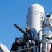 Fire Controlman 1st Class Anthony Wilkes, left, from Petersburg, Ind., and Fire Controlman 2nd Class Nathan Gurle, right, from Auburn, Ill., conduct maintenance on a Mk 15 close-in weapons system