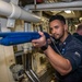 Fire Controlman 2nd Class Dylan Rodriguez, from Menifee, Calif., clears a passageway, with a simtraining firearm, during an anti-terrorism drill