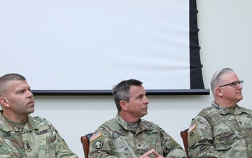 86th Training Division leadership listen to a speaker during the Change of Responsibility ceremony