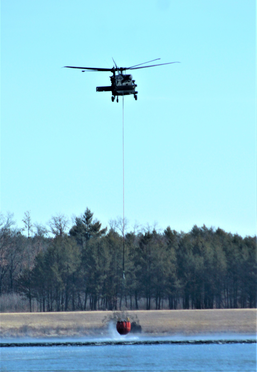 Federal, state agencies partner for fire-suppression training with Black Hawks at Fort McCoy