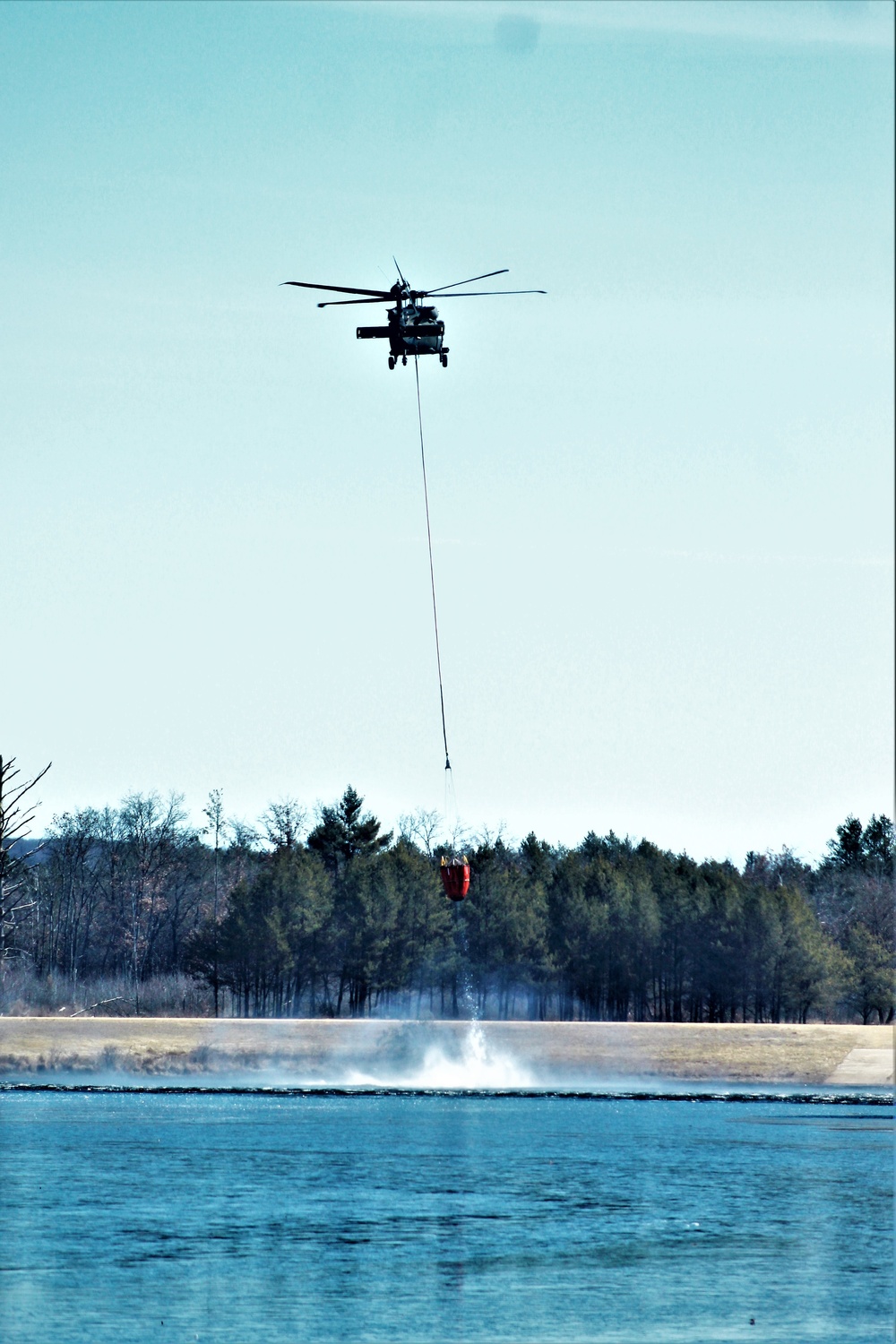 Federal, state agencies partner for fire-suppression training with Black Hawks at Fort McCoy