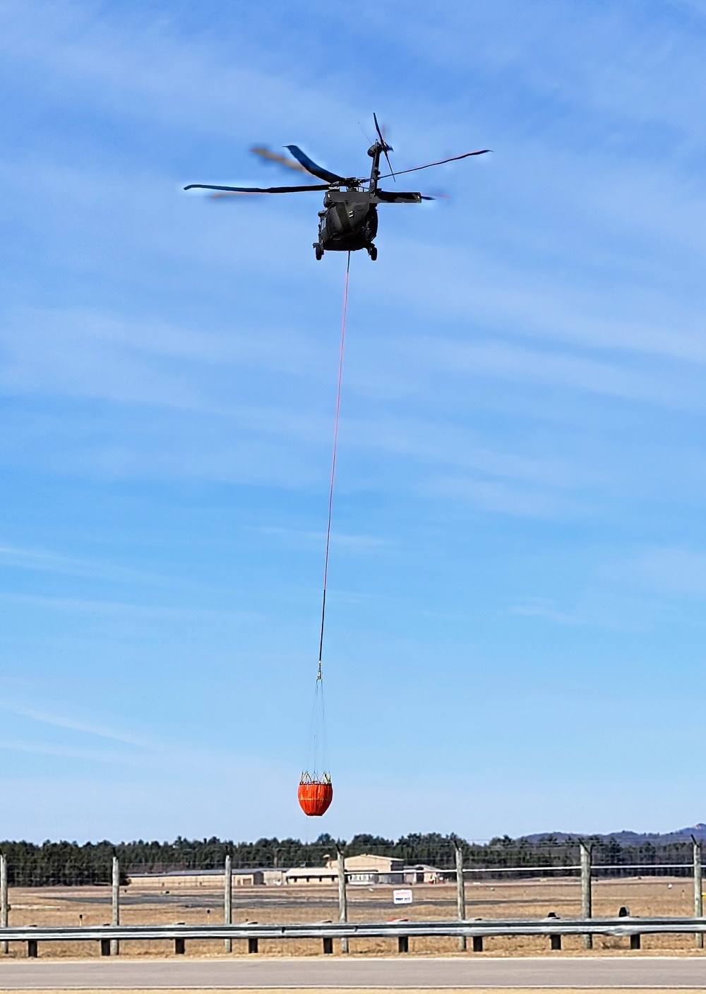 Federal, state agencies partner for fire-suppression training with Black Hawks at Fort McCoy