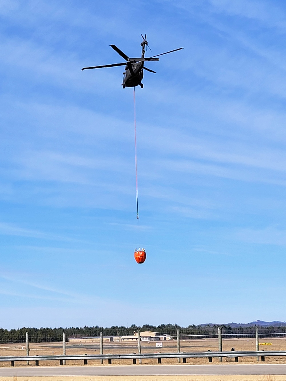 Federal, state agencies partner for fire-suppression training with Black Hawks at Fort McCoy