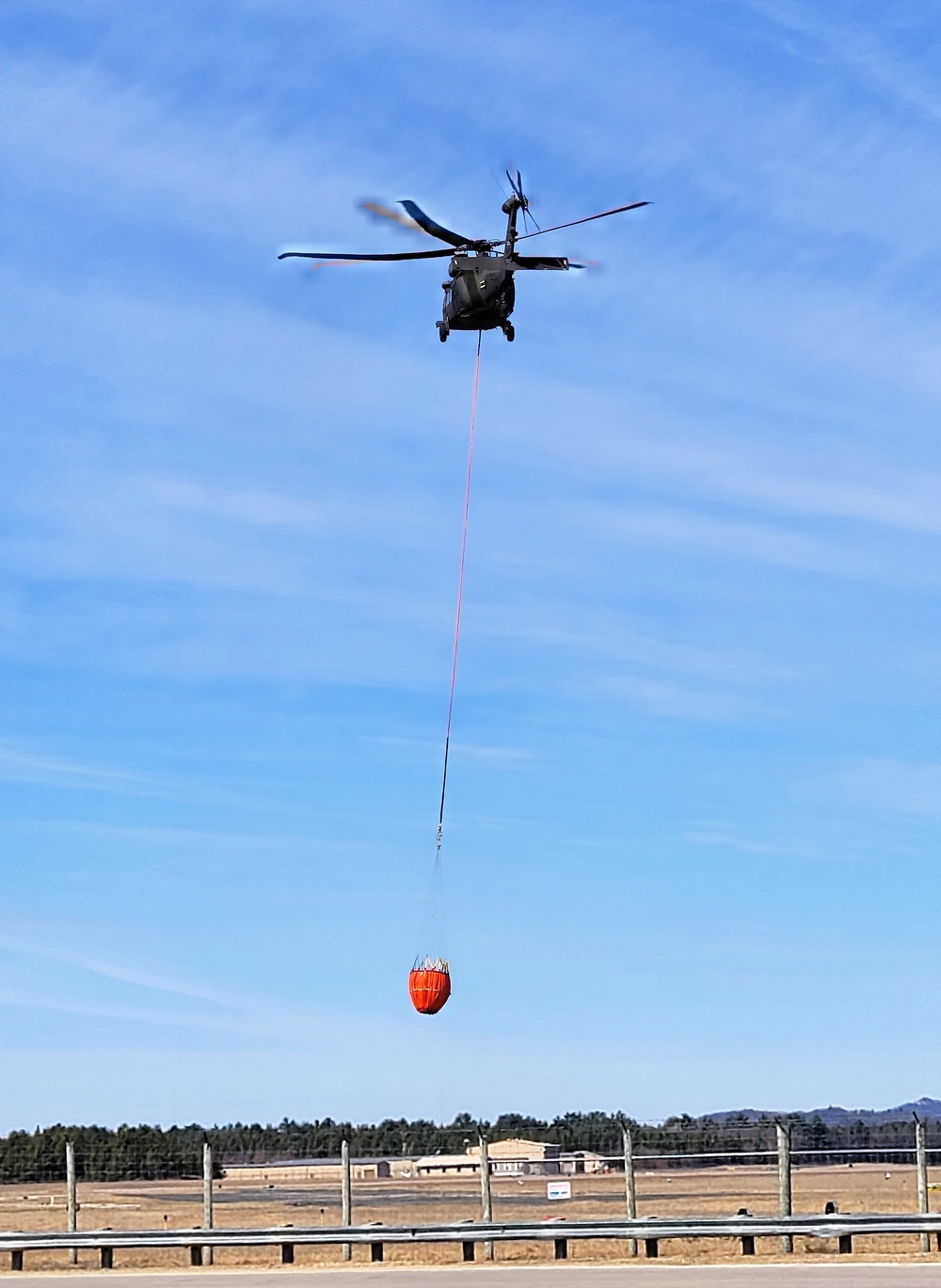 Federal, state agencies partner for fire-suppression training with Black Hawks at Fort McCoy