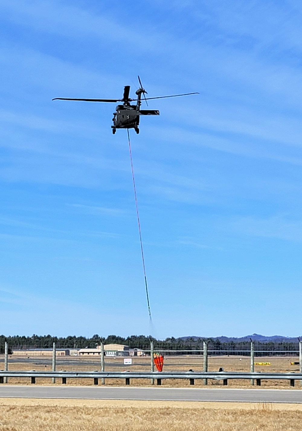 Federal, state agencies partner for fire-suppression training with Black Hawks at Fort McCoy