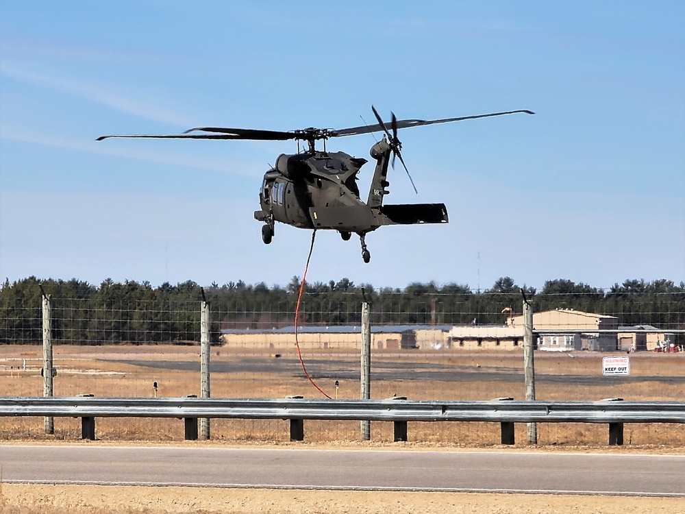 Federal, state agencies partner for fire-suppression training with UH-60 Black Hawks at Fort McCoy