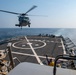 An MH-60S Sea Hawk helicopter assigned to the “Dragonslayers” of Helicopter Sea Combat Squadron (HSC) 11) prepares to land