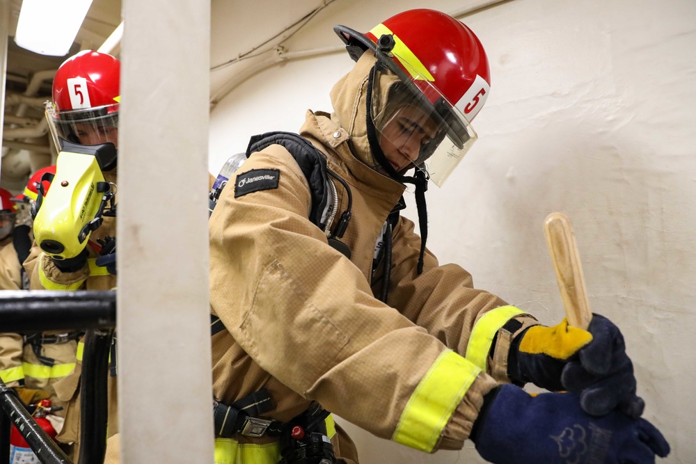 USS Ross Sailors hold main space fire drill