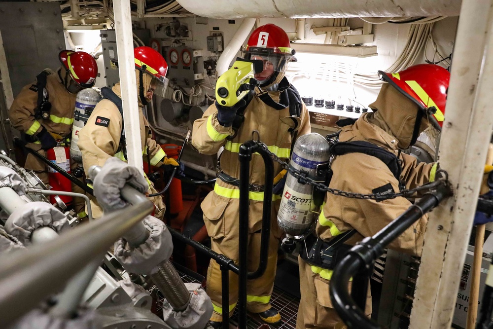 USS Ross Sailors hold main space fire drill
