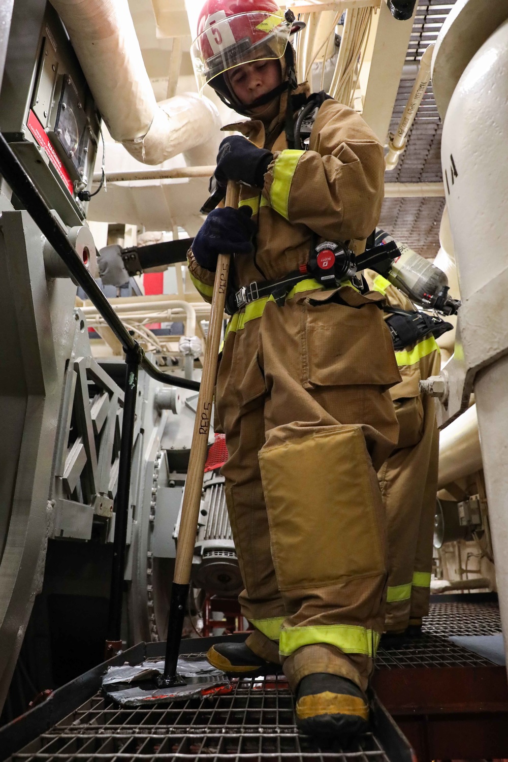 USS Ross Sailors hold main space fire drill