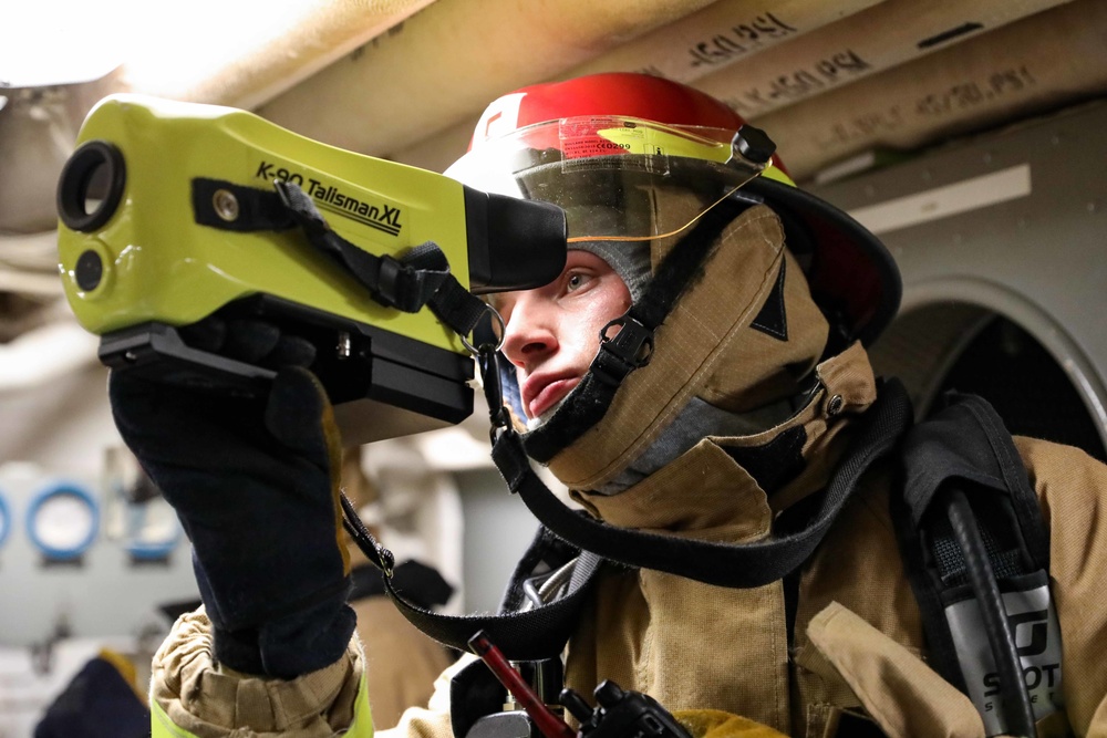 USS Ross Sailors hold main space fire drill