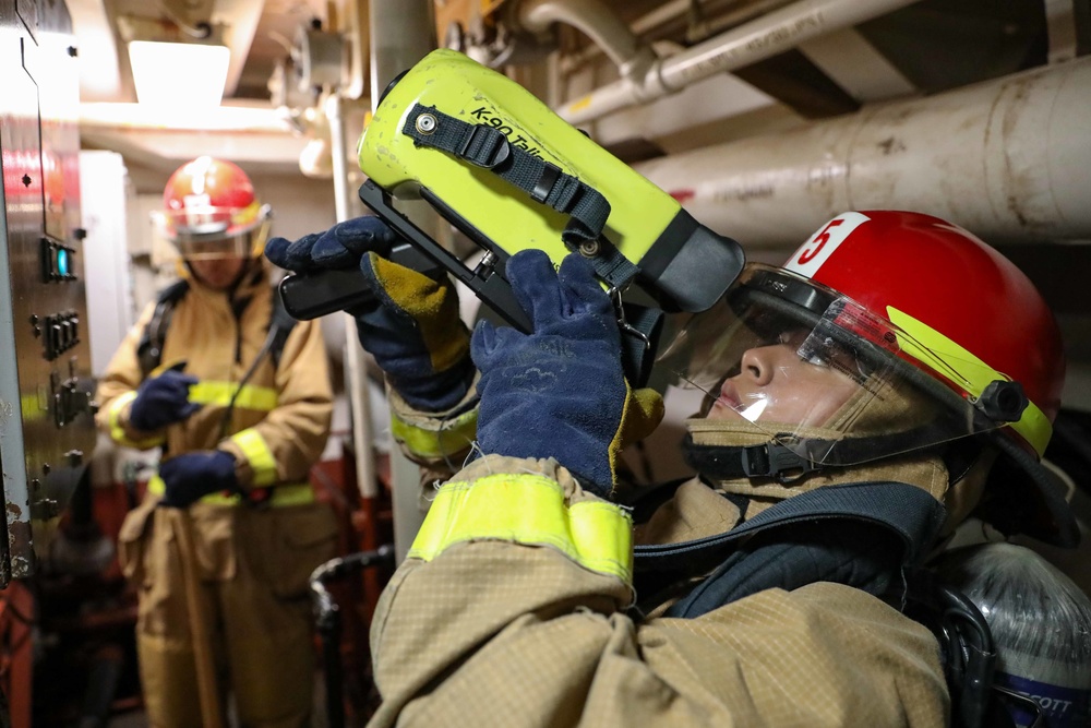 USS Ross Sailors hold main space fire drill