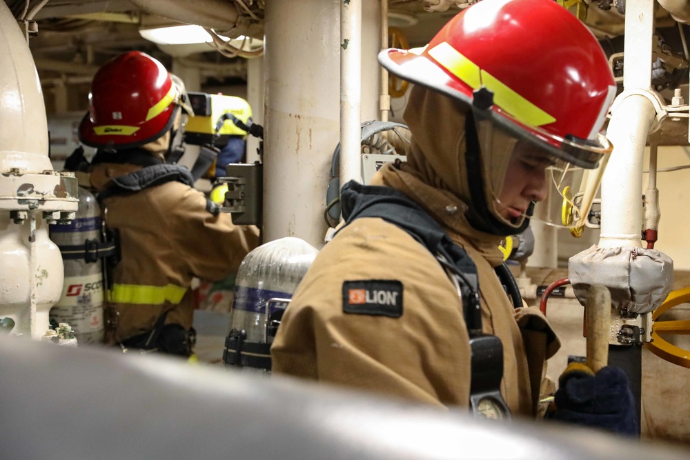 USS Ross Sailors hold main space fire drill