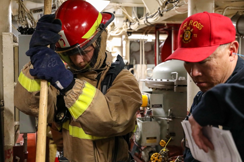 USS Ross Sailors hold main space fire drill