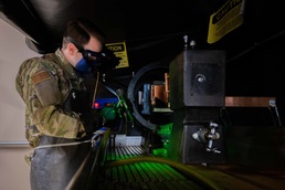 Airman inspects aircraft part