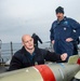 Chief Gunner’s Mate Thomas Lawrence, left, from Cedar City, Utah, and Gunner’s Mate 2nd Class Jay Davis, from Virginia Beach, Va., conduct maintenance on an MK-32 torpedo