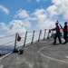 Sailors Fire a Line From USS Higgins