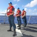 Sailors Hold Line Aboard USS Higgins