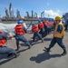 Sailors Heave Line Aboard USS Higgins