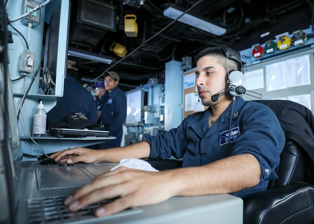 Operations Specialist Monitors Surface Contacts from USS Higgins