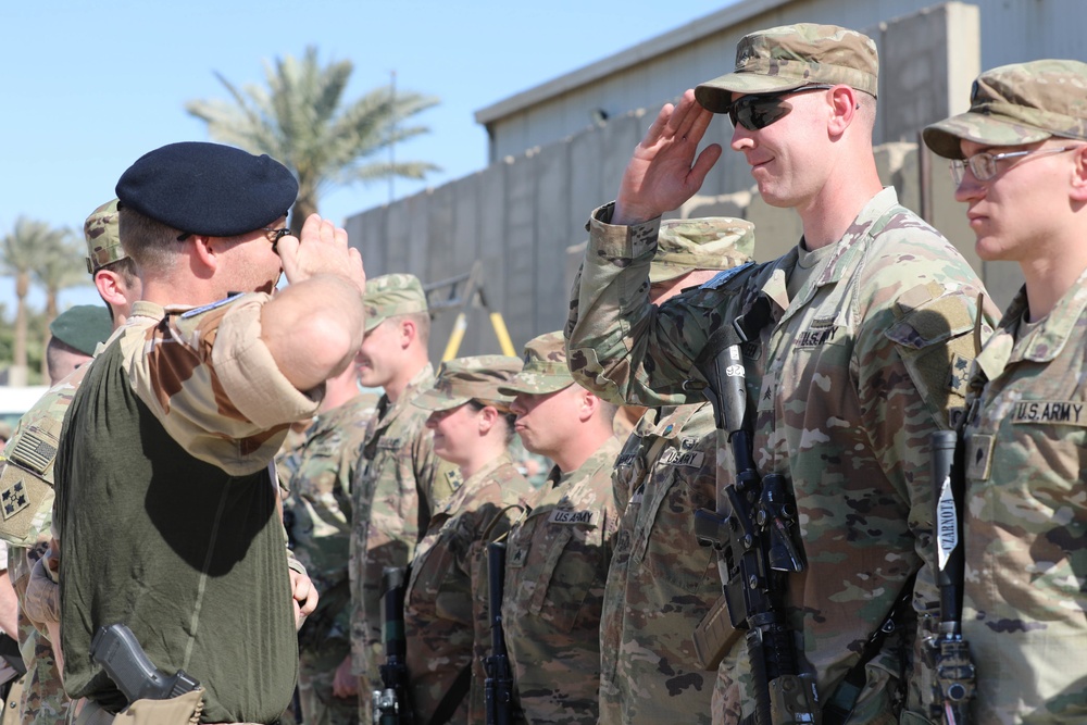 Soldiers receive the Norwegian foot march badge and certificate