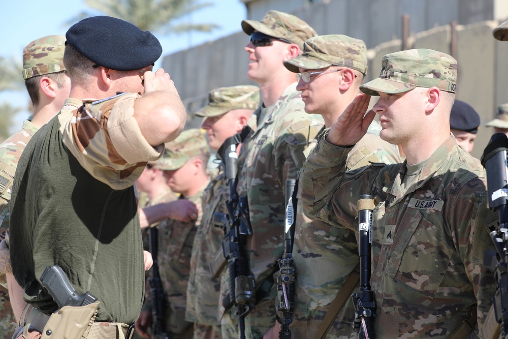 Soldiers receive the Norwegian foot march badge and certificate