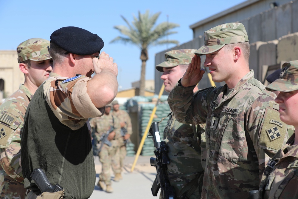 Soldiers receive the Norwegian foot march badge and certificate