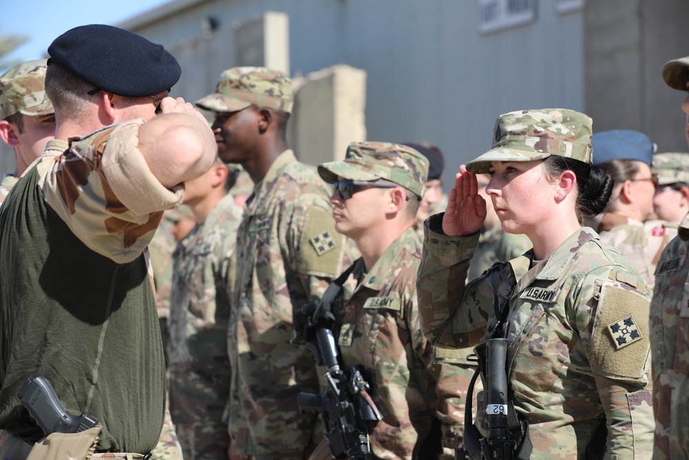 Soldiers receive the Norwegian foot march badge and certificate