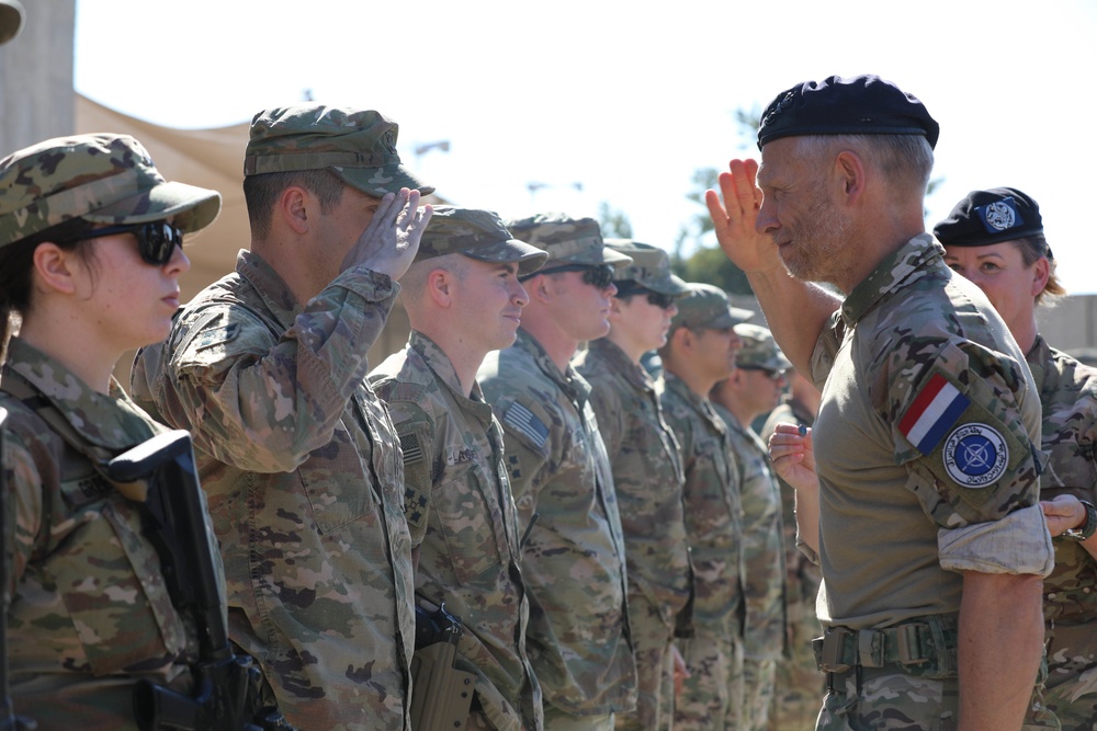 Soldiers receive the Norwegian foot march badge and certificate