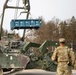 Soldiers of the 10th Brigade  Engineer Battalion, 1st Armored Brigade Combat Team, 3rd Infantry Division lift an inert round for the Mine Clearing Line Charge (MiC-LiC)