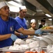 Abraham Lincoln Sailors serve food