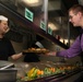 Abraham Lincoln Sailors serve food