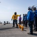 Sailors aboard Arleigh Burke-class guided-missile destroyer USS Mitscher (DDG 57) verify chocks and chains are removed from an MH-60S Sea Hawk helicopter