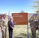 LTC Colestock, Mrs. Eileen Sullivan niece of MSG Artesani, CSM Rogers and CSM of the Army CSM Lombardo pose for a photo in front of the Artesani sign.