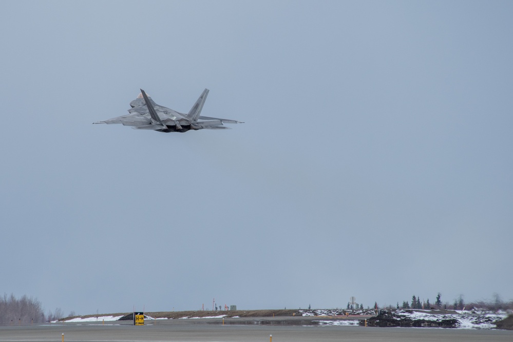 F-22s take off from Ted Stevens during PF 22-4