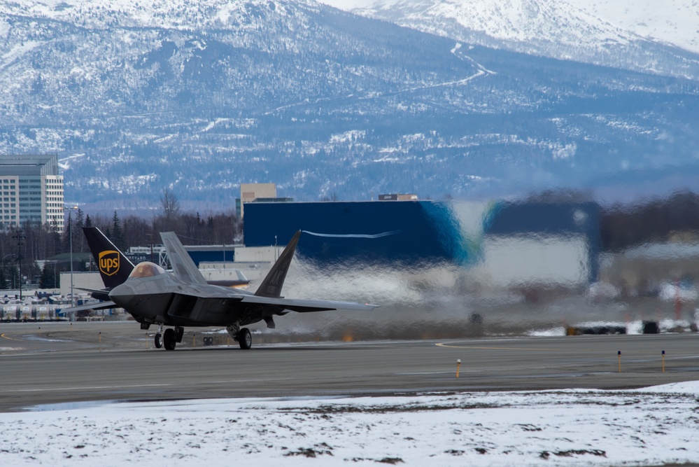 F-22s take off from Ted Stevens during PF 22-4