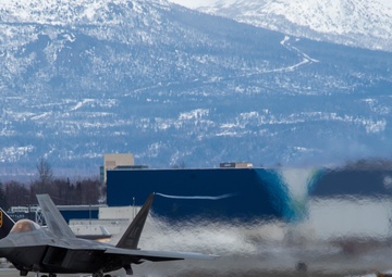 F-22s take off from Ted Stevens during PF 22-4