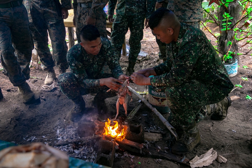 Balikatan 22 - Philippine Marines demonstrate field cooking techniques