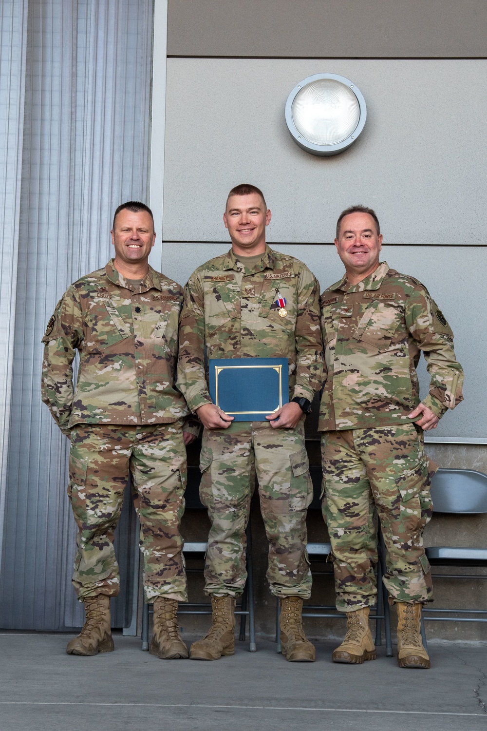 Col. Brian Gunderson, Nevada Air National Guard Director of Staff-Air awards the Nevada Medal of Valor to Tech. Sgt. Cody Sharkey