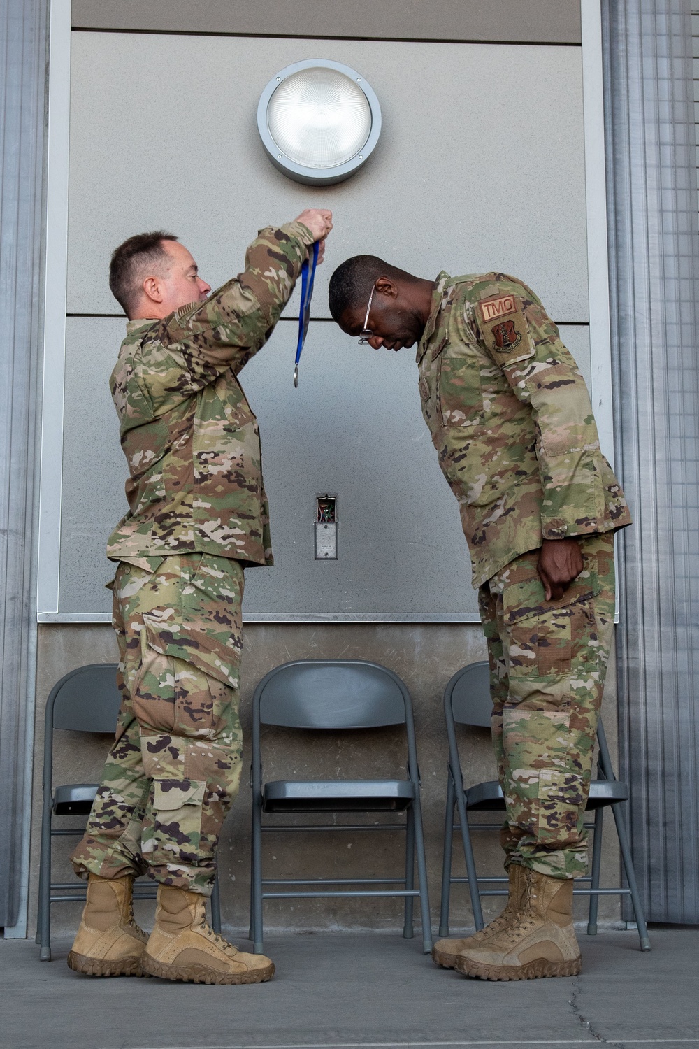 Col. Brian Gunderson, Nevada Air National Guard Director of Staff-Air awards the Maj. Gen. Drennan A. Clark Order of Nevada to Senior Master Sgt. Jordan Clark